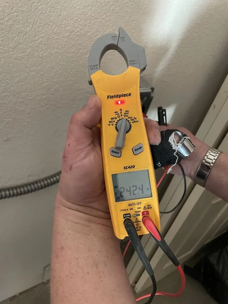 Voltage testing with clamp meter during Recessed Lighting Installation in South Beloit